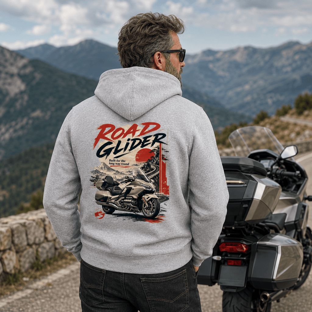 Model wearing the Camberline Riders Road Glider Touring Motorcycle Hoodie – Heather Grey, showing the Camberline Riders graphic in a motorcycle-inspired setting
