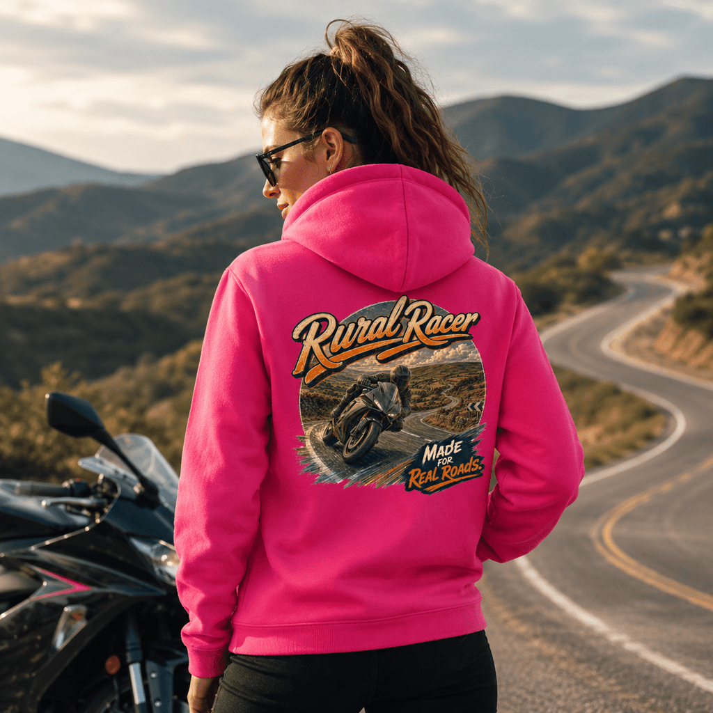 Model wearing the Camberline Riders Rural Racer Sports Bike Hoodie – Hot Pink, showing the Camberline Riders graphic in a motorcycle-inspired setting