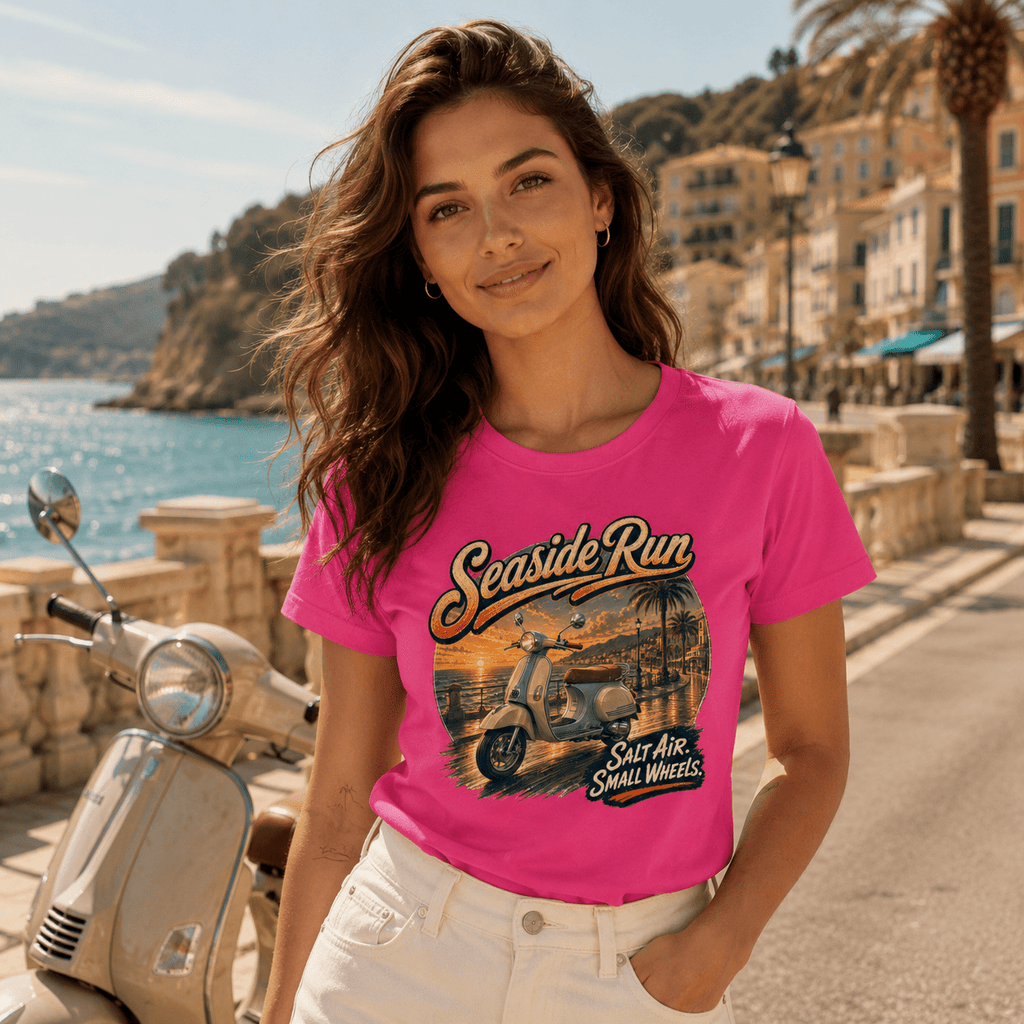Model wearing the Camberline Riders Seaside Run Classic Scooter T-Shirt – Hot Pink, showing the Camberline Riders graphic in a motorcycle-inspired setting