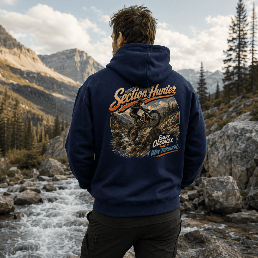 Model wearing the Camberline Riders Section Hunter Trials Bike Hoodie – Navy, showing the Camberline Riders graphic in a motorcycle-inspired setting