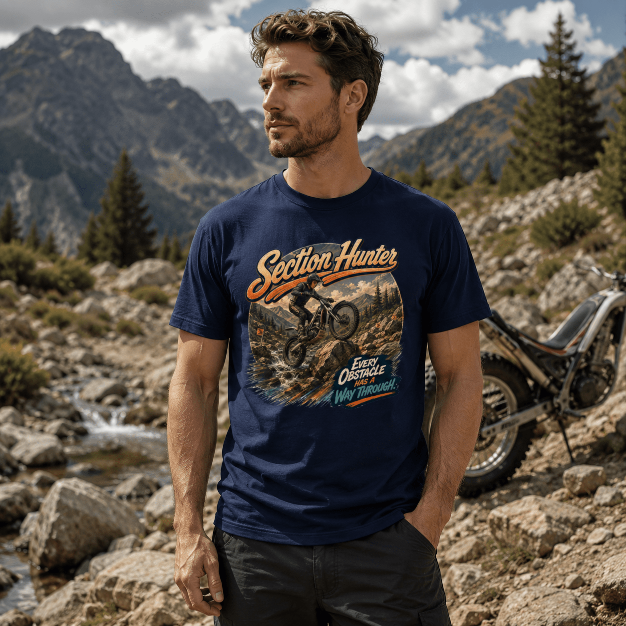 Model wearing the Camberline Riders Section Hunter Trials Bike T-Shirt – Navy, showing the Camberline Riders graphic in a motorcycle-inspired setting