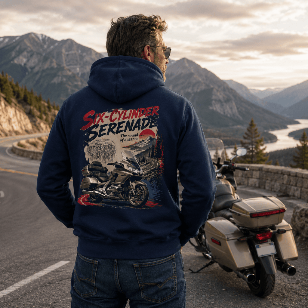 Model wearing the Camberline Riders Six Cylinder Serenade Luxury Tourer Hoodie – Navy, showing the Camberline Riders graphic in a motorcycle-inspired setting