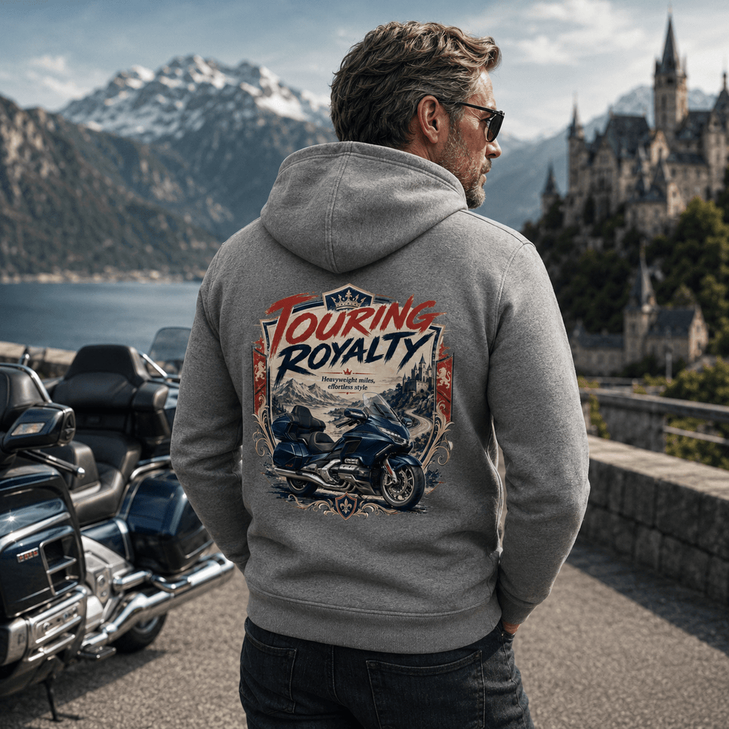 Model wearing the Camberline Riders Touring Royalty Heavy Tourer Hoodie – Charcoal, showing the Riders back graphic in a motorcycle-inspired setting