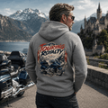 Model wearing the Camberline Riders Touring Royalty Heavy Tourer Hoodie – Charcoal, showing the Riders back graphic in a motorcycle-inspired setting