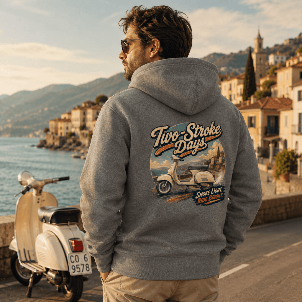Model wearing the Camberline Riders Two Stroke Days Vintage Scooter Hoodie – Charcoal, showing the Riders back graphic in a motorcycle-inspired setting
