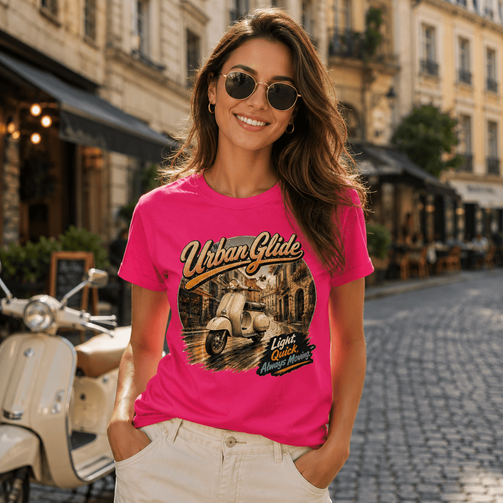 Model wearing the Camberline Riders Urban Glide Retro Scooter T-Shirt – Hot Pink, showing the Riders front graphic in a motorcycle-inspired setting