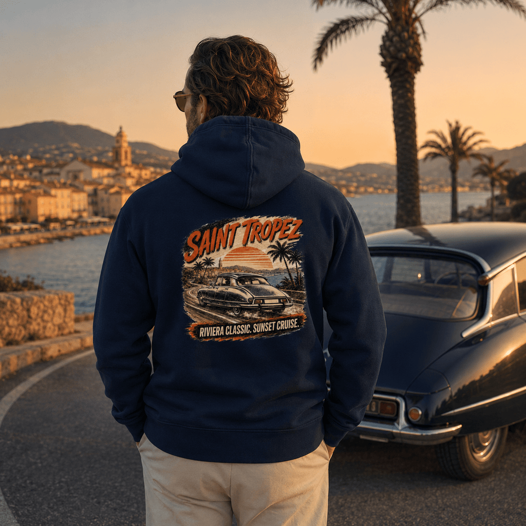 Model wearing Camberline Cars Saint Tropez Riviera Classic Sunset Cruise French Hoodie in Navy