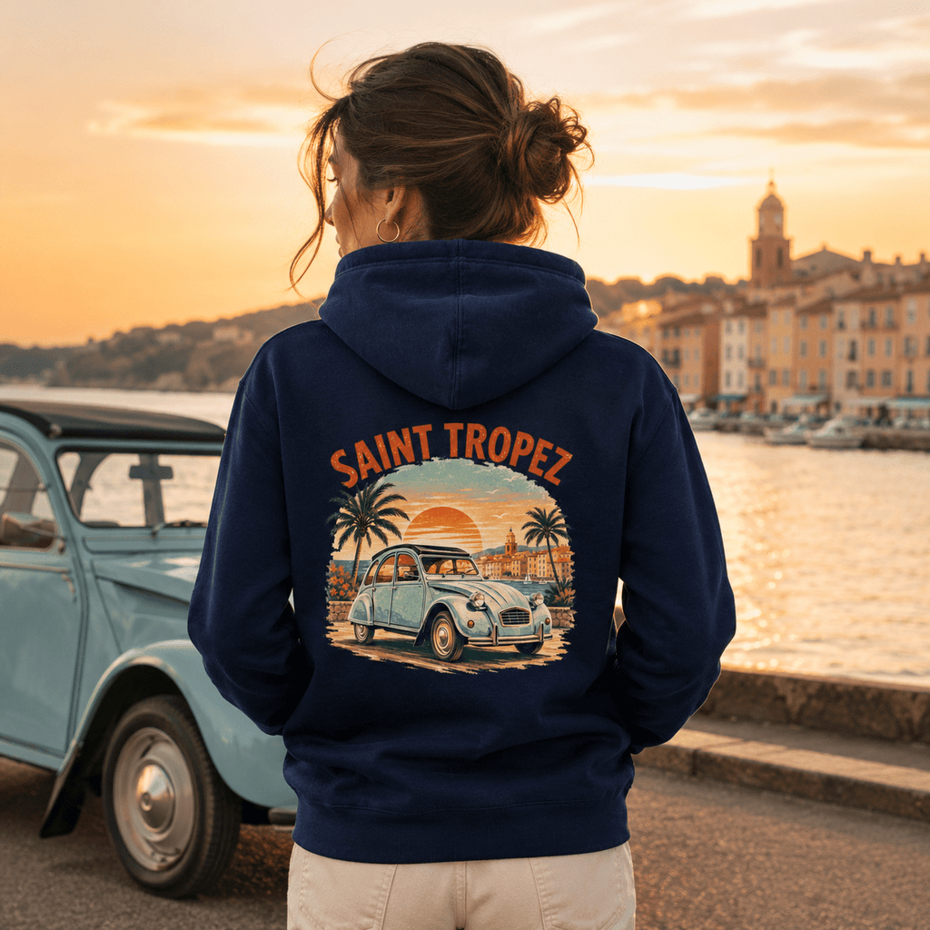 Model wearing Camberline Cars Saint Tropez Vintage French Coastal Sunset Hoodie in Navy