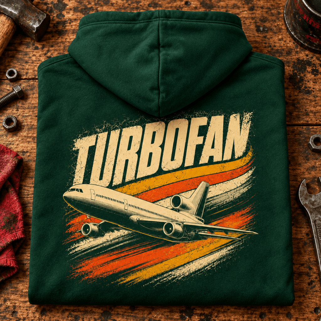 Turbofan Trijet Airliner hoodie in Bottle Green, folded on a workshop bench, showing the back print