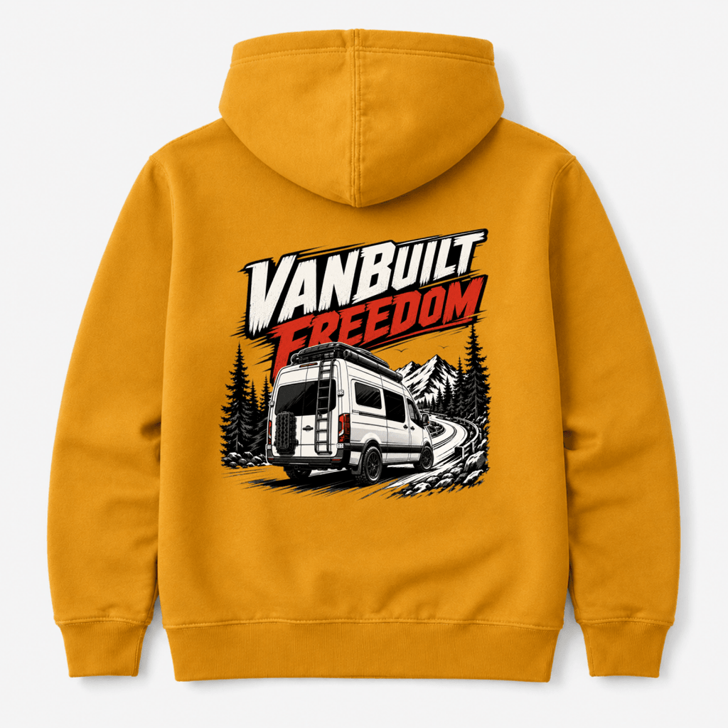 Camberline VanBuilt Freedom rear-view high-roof van with ladder on mountain road, amber/mustard hoodie, back view