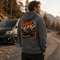 Model wearing Camberline dark heather van life hoodie showing Van Life Chase Horizons black and orange van and mountain graphic on back