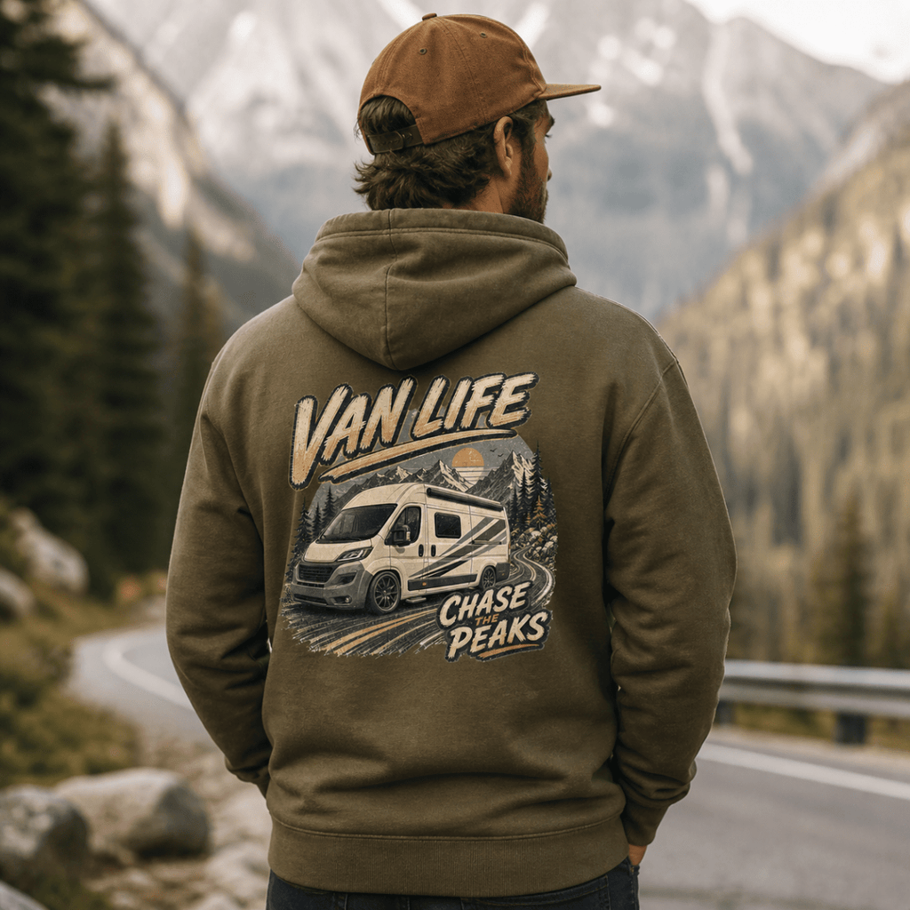 Person wearing a hoodie with 'Van Life' and 'Chase Peaks' design in a mountainous landscape.