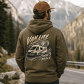 Person wearing a hoodie with 'Van Life' and 'Chase Peaks' design in a mountainous landscape.