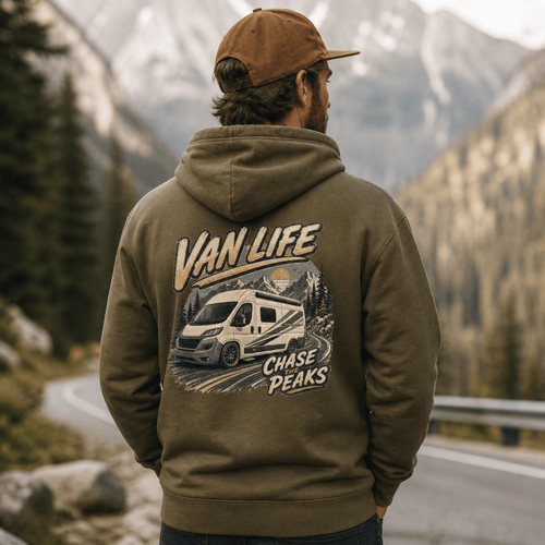 Person wearing a hoodie with 'Van Life' and 'Chase Peaks' design in a mountainous landscape.