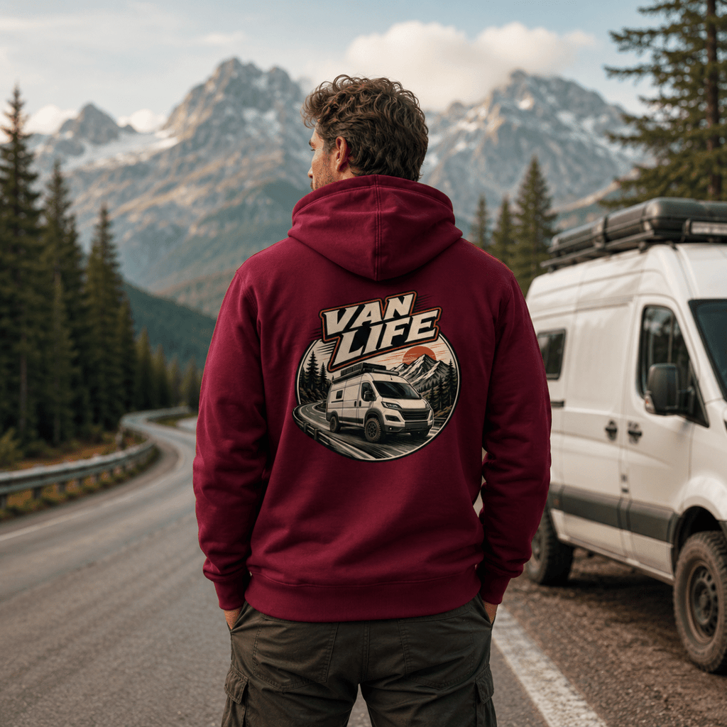 Model wearing Camberline burgundy van life hoodie showing Van Life circle badge with high-roof van on mountain road at sunset on back
