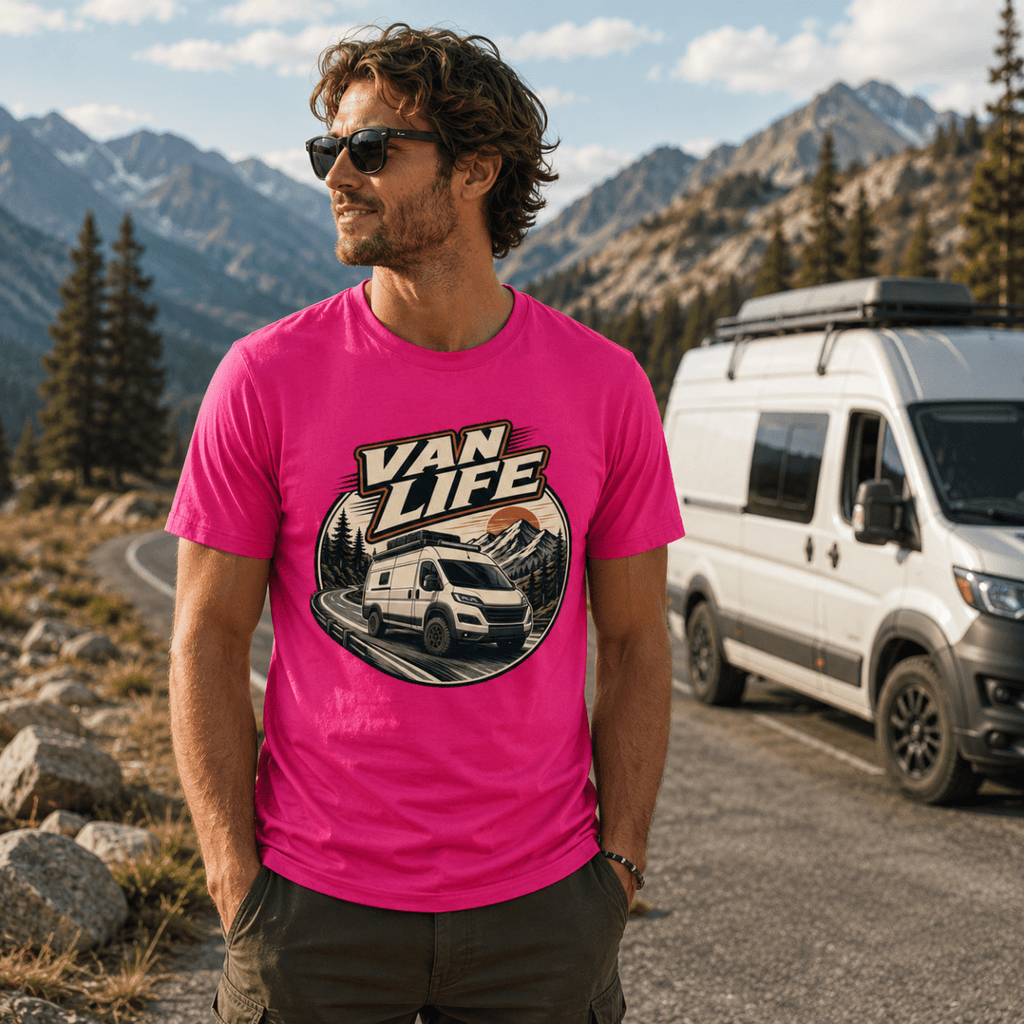 Model wearing Camberline pink van life t-shirt showing Van Life circle badge with high-roof 4x4 van on mountain road at sunset on chest