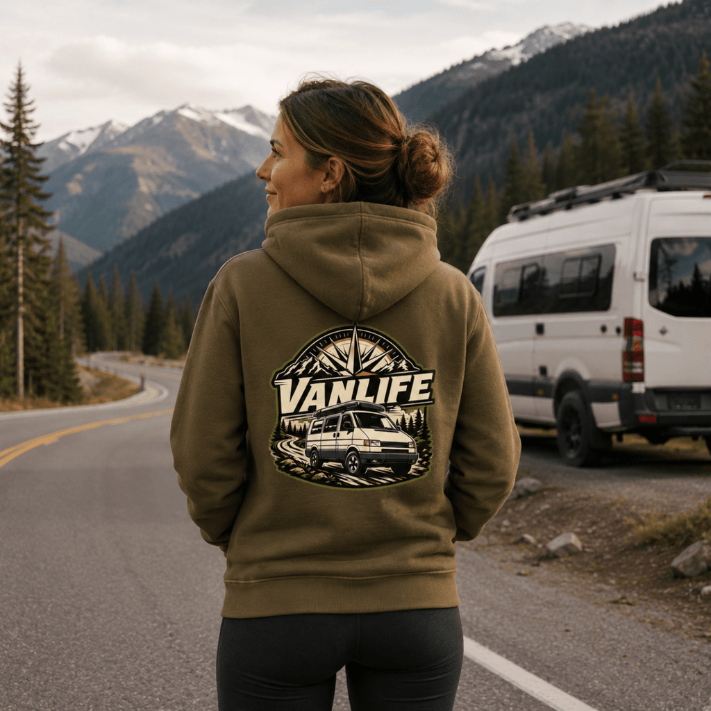 Model wearing Camberline olive van life hoodie showing VanLife compass badge with retro van and mountain graphic on back