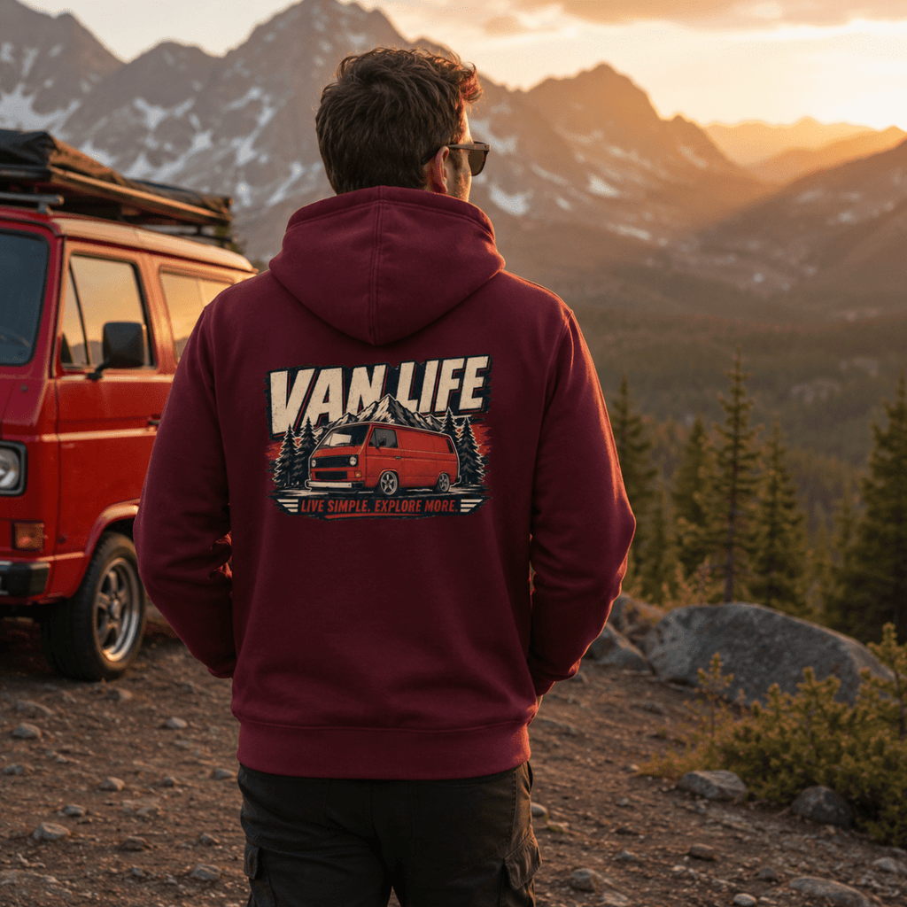 Model wearing Camberline burgundy van life hoodie showing Van Life Live Simple Explore More red retro boxy van and mountain graphic on back