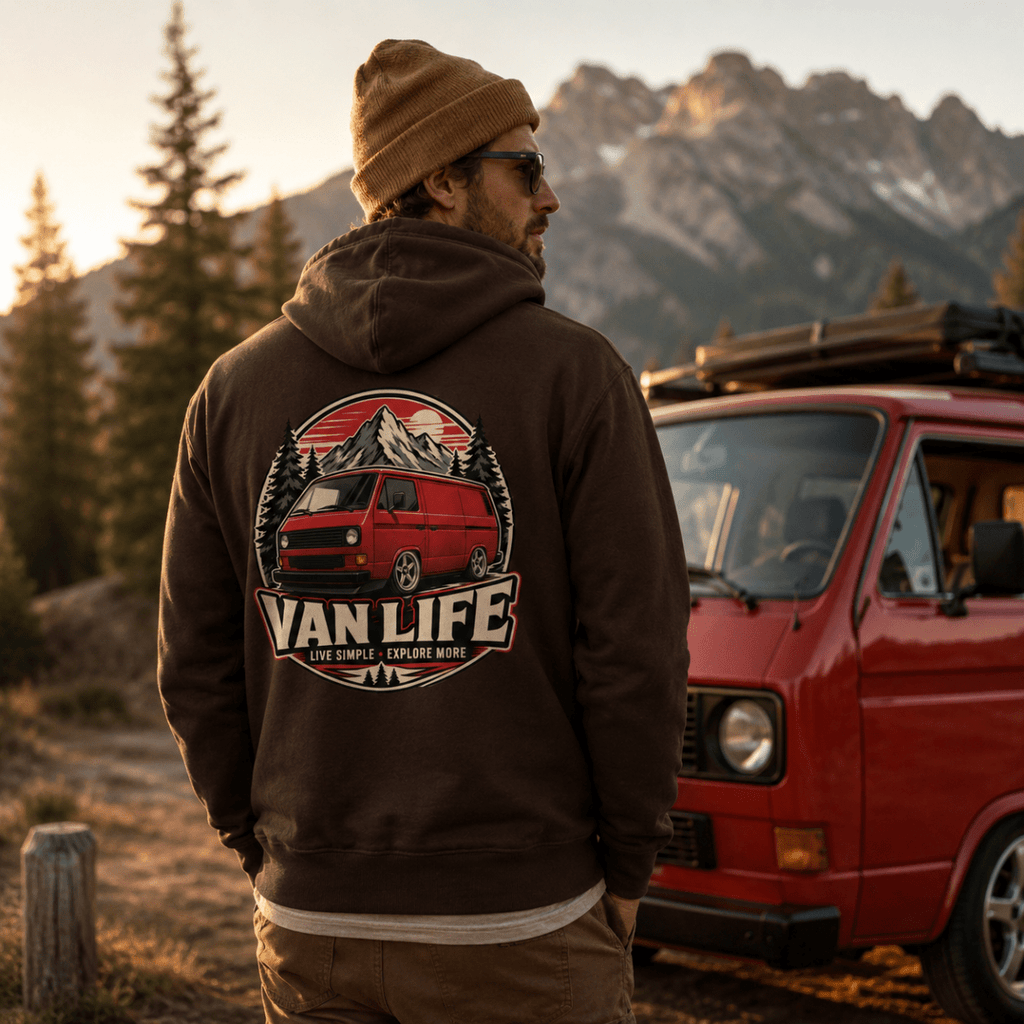 Model wearing Camberline chocolate brown van life hoodie showing Van Life Live Simple Explore More red retro van circle badge on back
