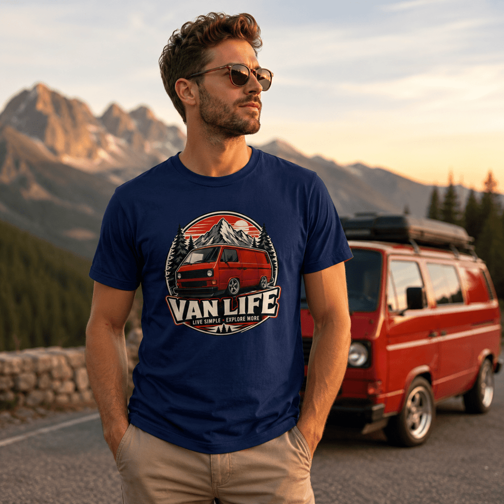 Model wearing Camberline navy van life t-shirt showing Van Life Live Simple Explore More red retro van circle badge on chest