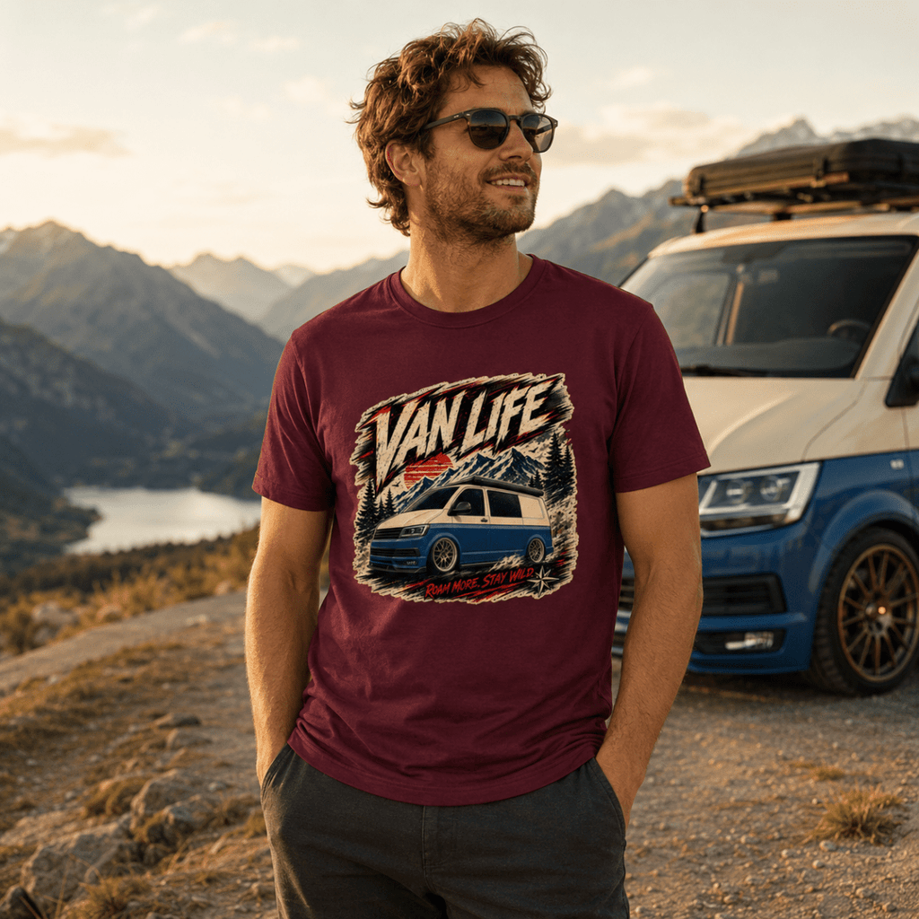 Man wearing a 'Van Life' t-shirt with a car graphic, standing in front of a scenic mountain landscape.