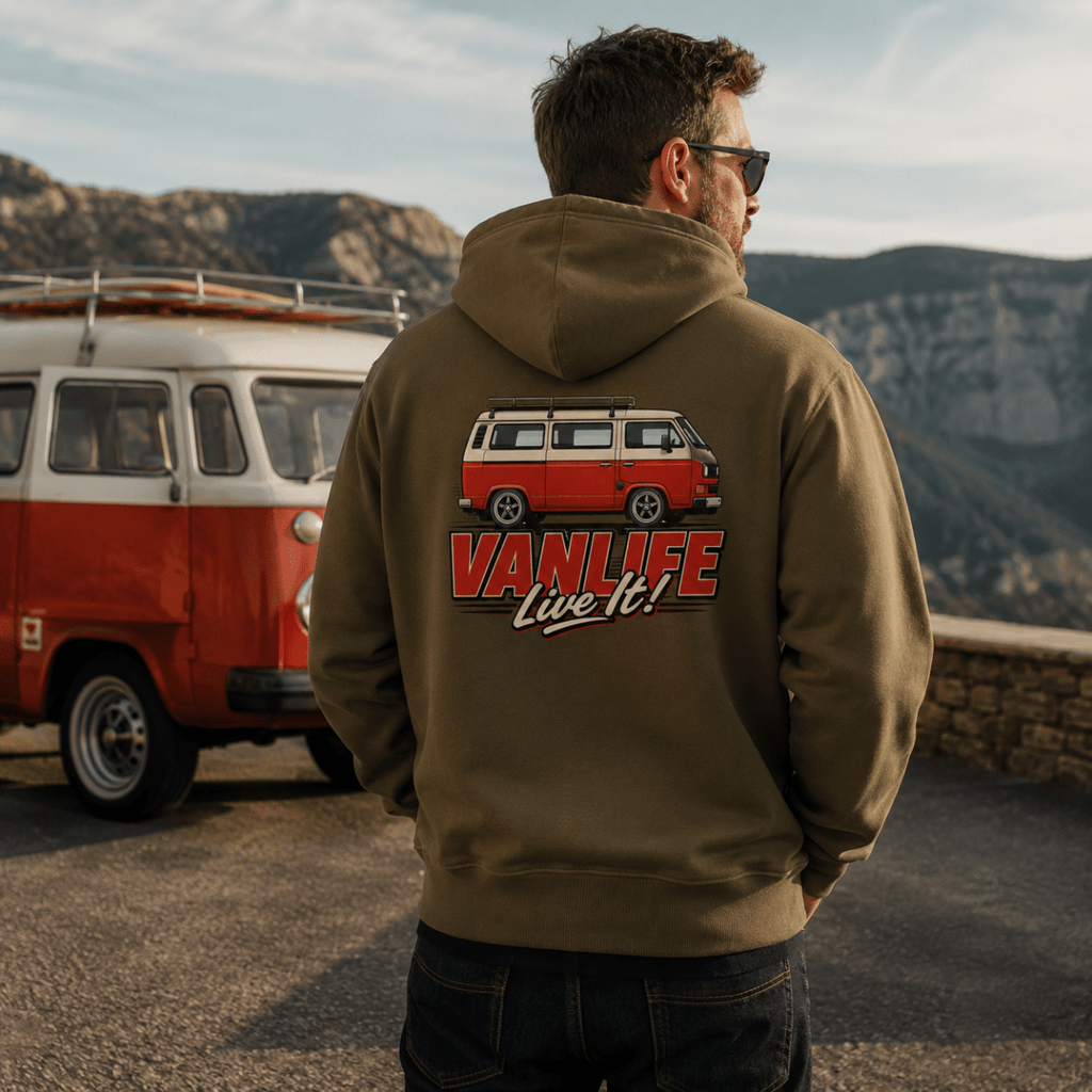 Model wearing Camberline olive van life hoodie showing VanLife Live It red and cream retro campervan side profile graphic on back