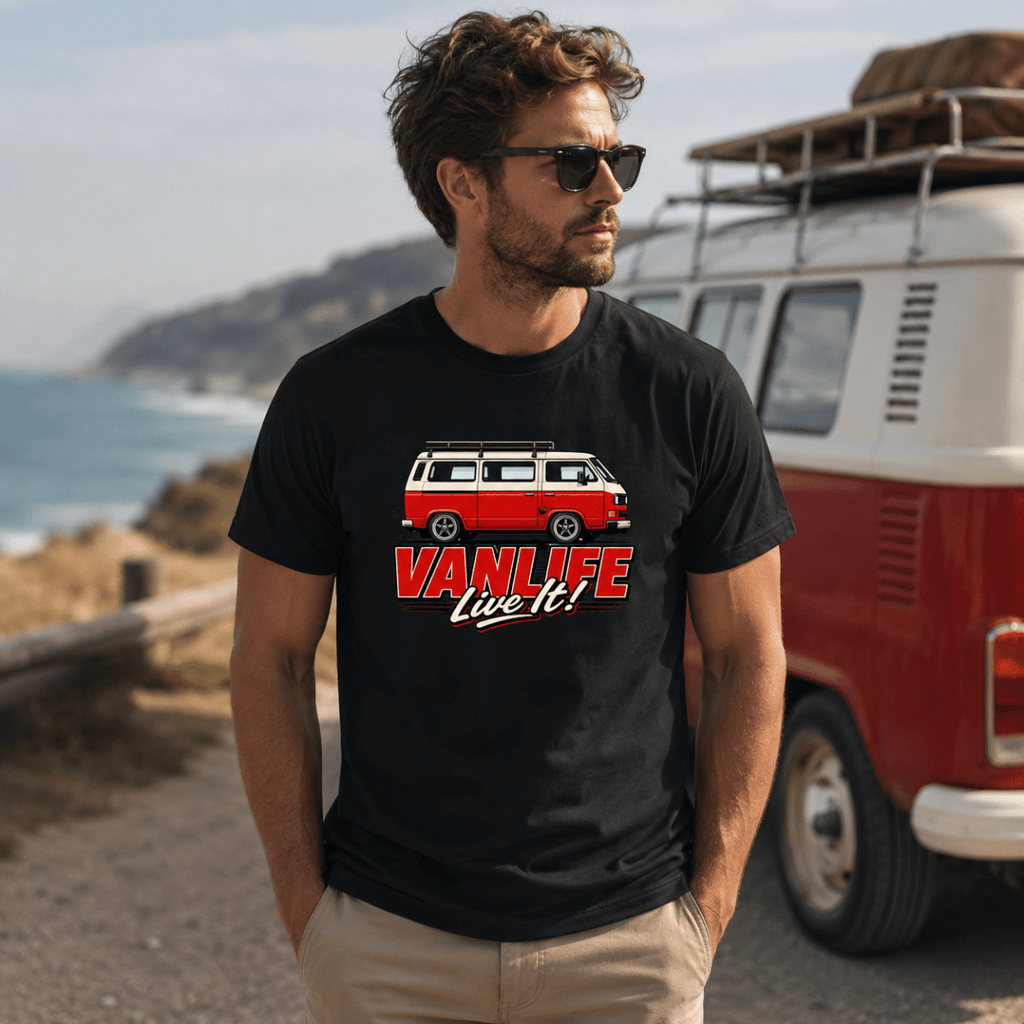 Model wearing Camberline black van life t-shirt showing VanLife Live It red and cream retro campervan side profile on chest