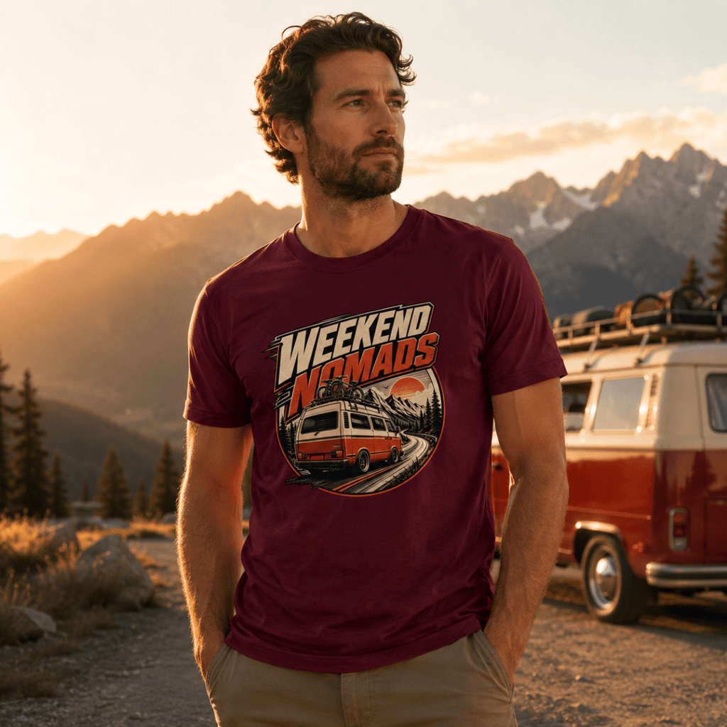 Model wearing Camberline burgundy van life t-shirt showing Weekend Nomads rear-view retro van with bikes and mountain sunset badge on chest