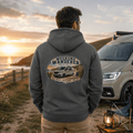Model wearing Camberline dark heather van life hoodie showing Weekend Wanderer British Van Life coastal van and sunrise badge on back