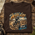 Camberline Wild Line enduro adventure brown T-shirt front print in a trail-side setting