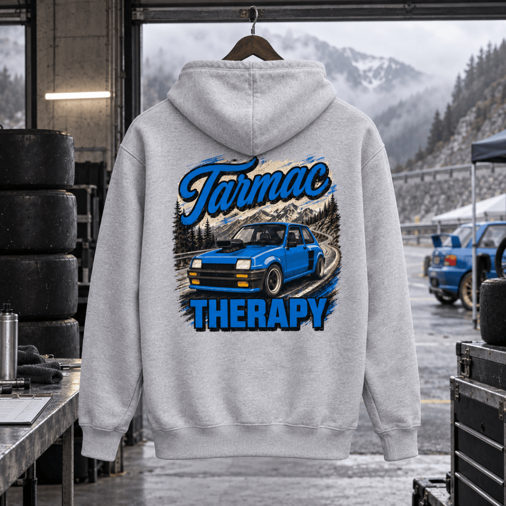 Tarmac Therapy light grey hoodie back in a gritty hill-climb service bay