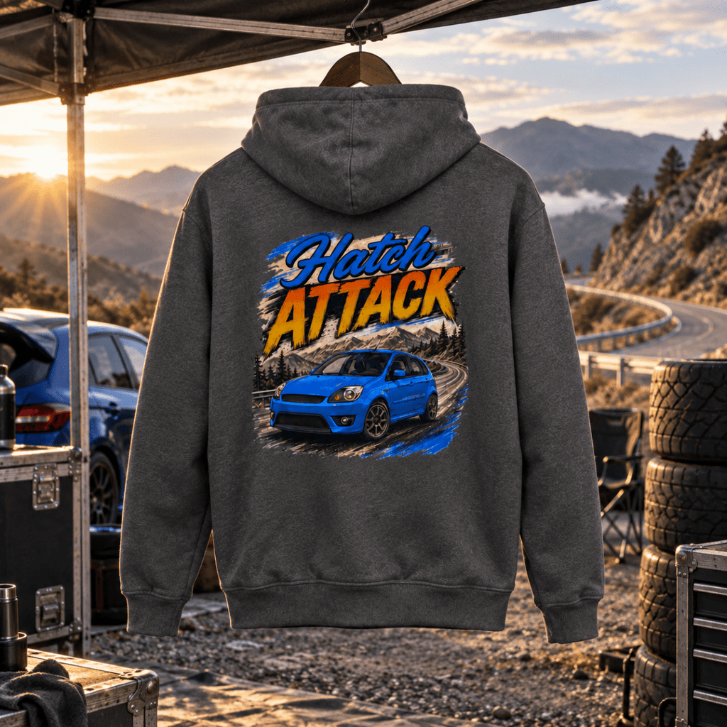 Hatch Attack grey hoodie back in a gritty hill-climb paddock