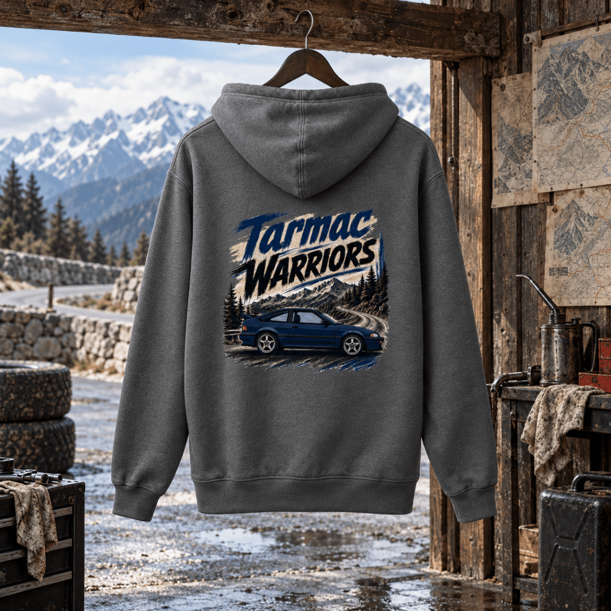 Tarmac Warriors grey hoodie back in a gritty Alpine service shed