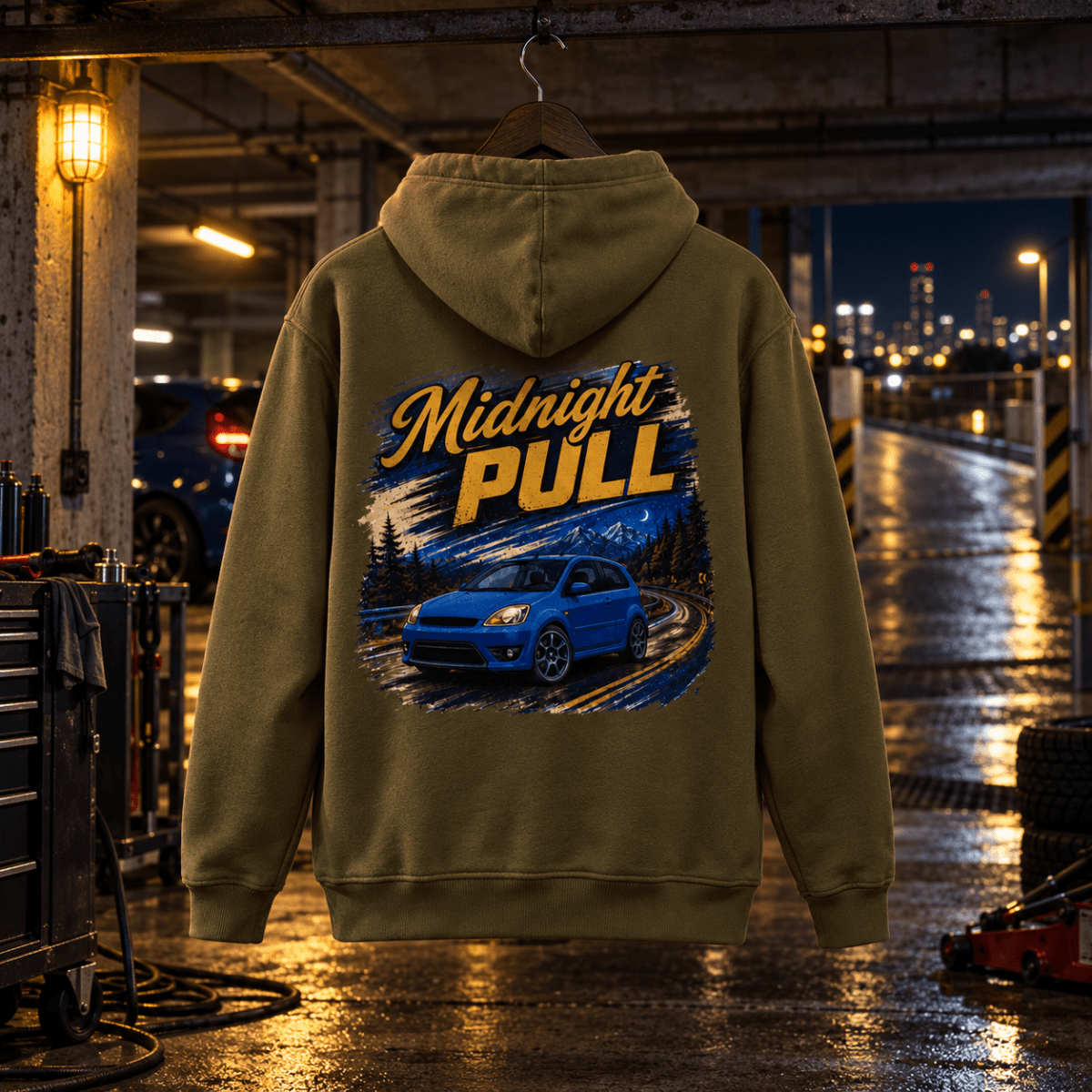 Midnight Pull combat green hoodie back in a gritty underground tuning garage