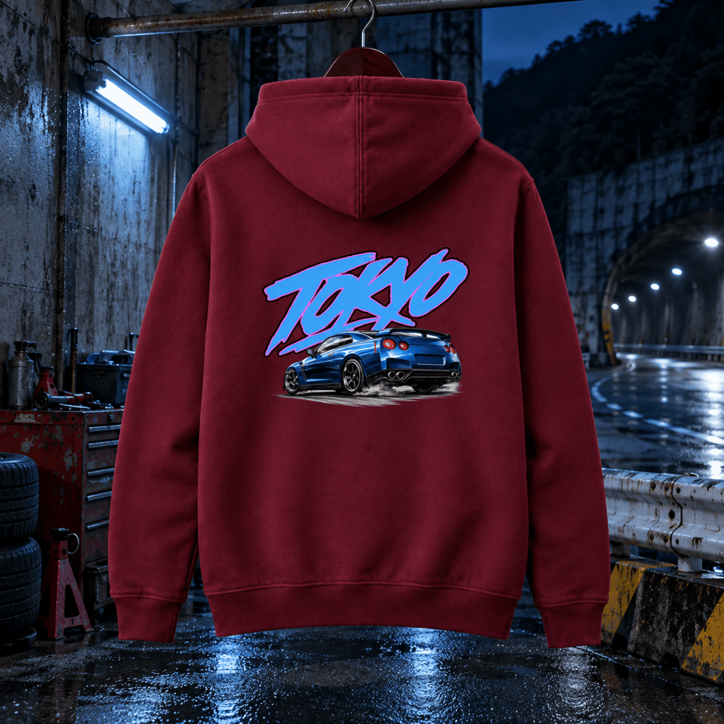 Tokyo blue sports car burgundy hoodie back in a gritty mountain tunnel service bay
