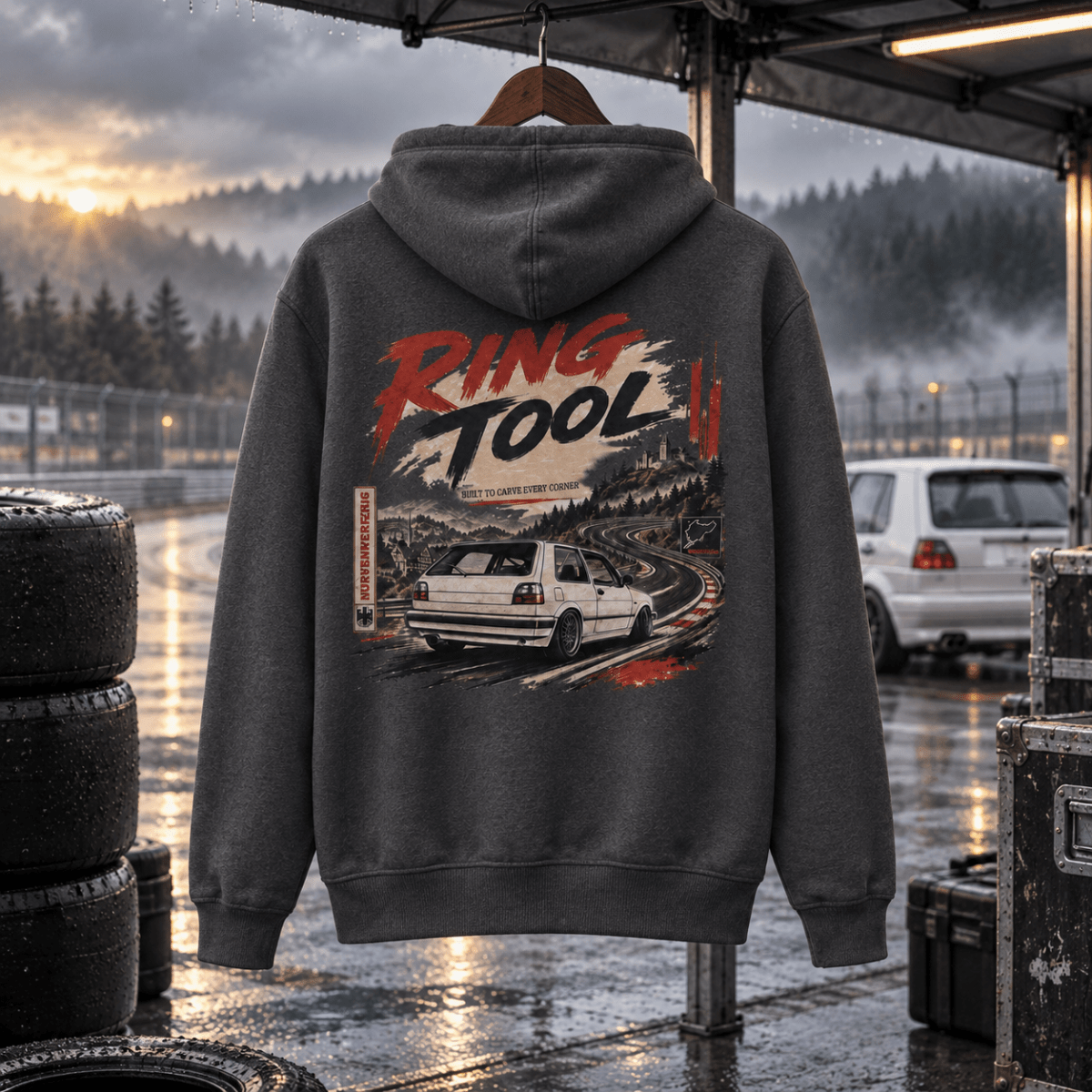 Ring Tool storm grey hoodie back in a gritty wet track-day paddock