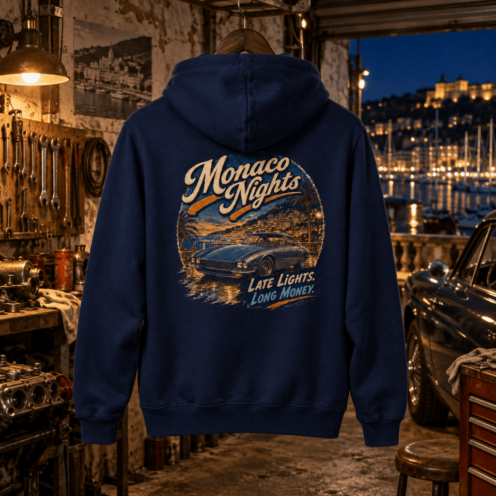 Monaco Nights navy hoodie back in a gritty Riviera restoration bay