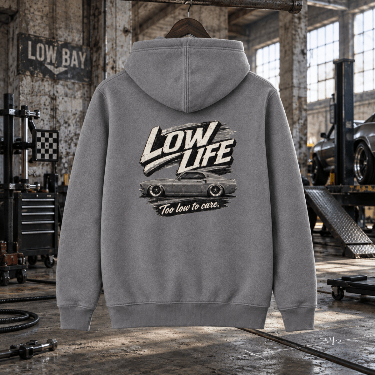Low Life heather grey hoodie back in a gritty railway depot suspension workshop