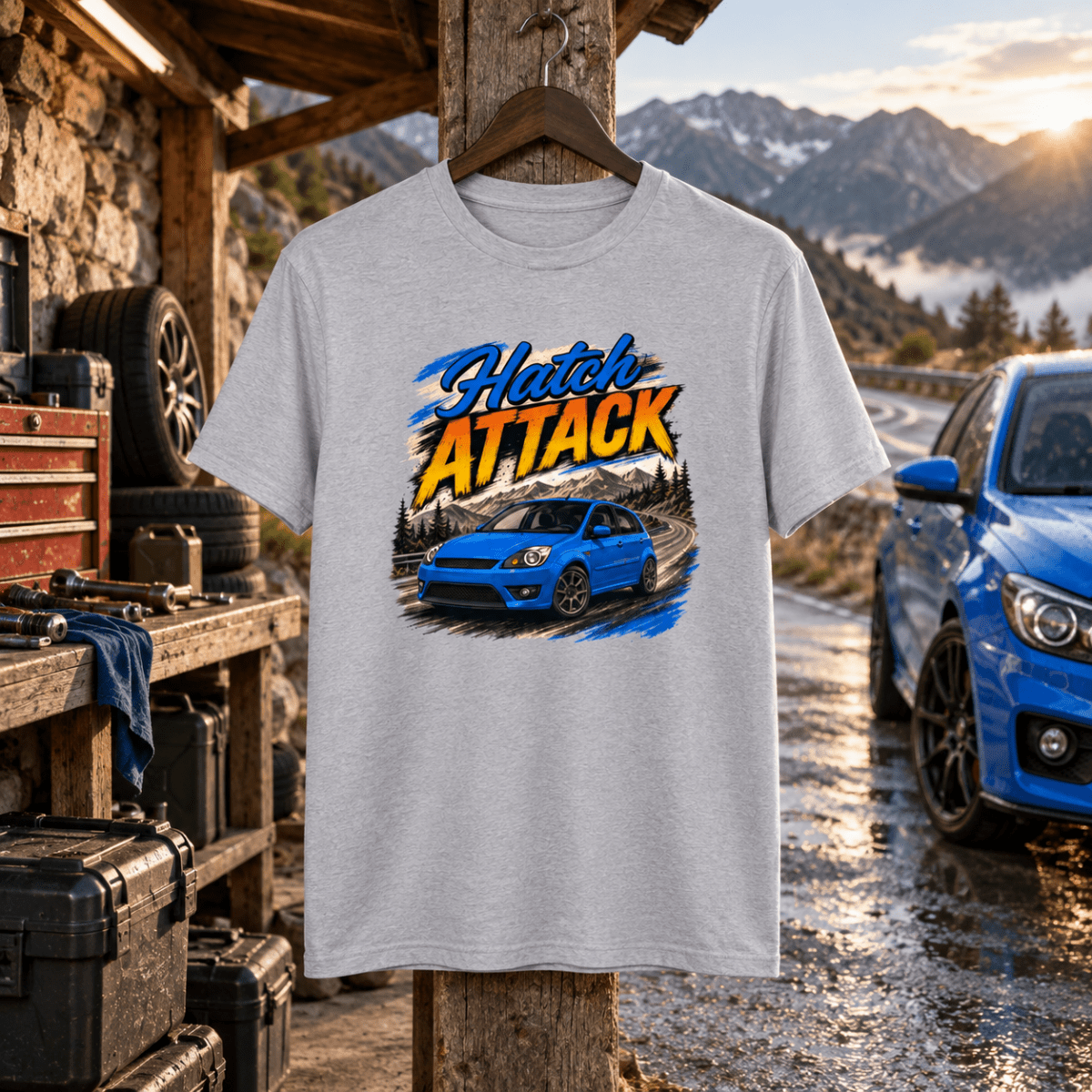 Hatch Attack grey T-shirt front in a gritty mountain road service hut