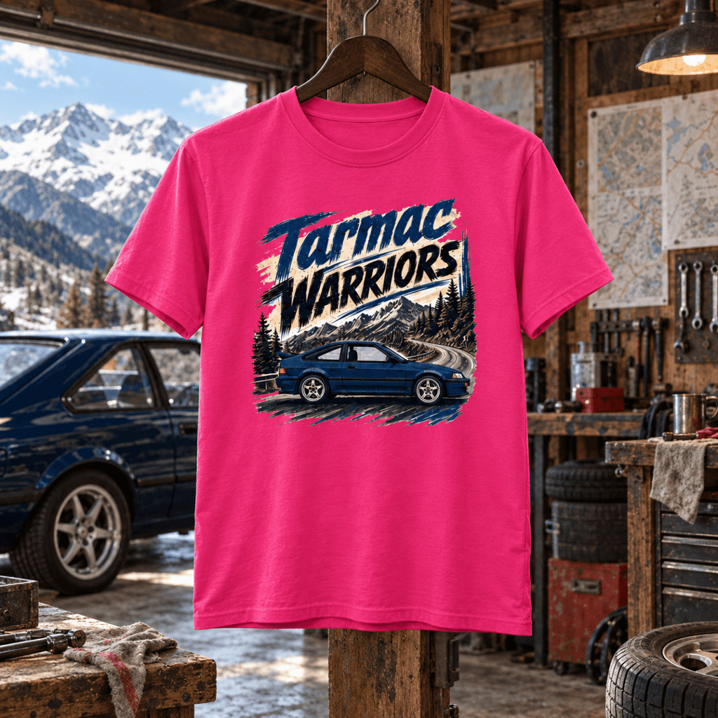 Tarmac Warriors hot pink T-shirt front in a gritty high-altitude workshop