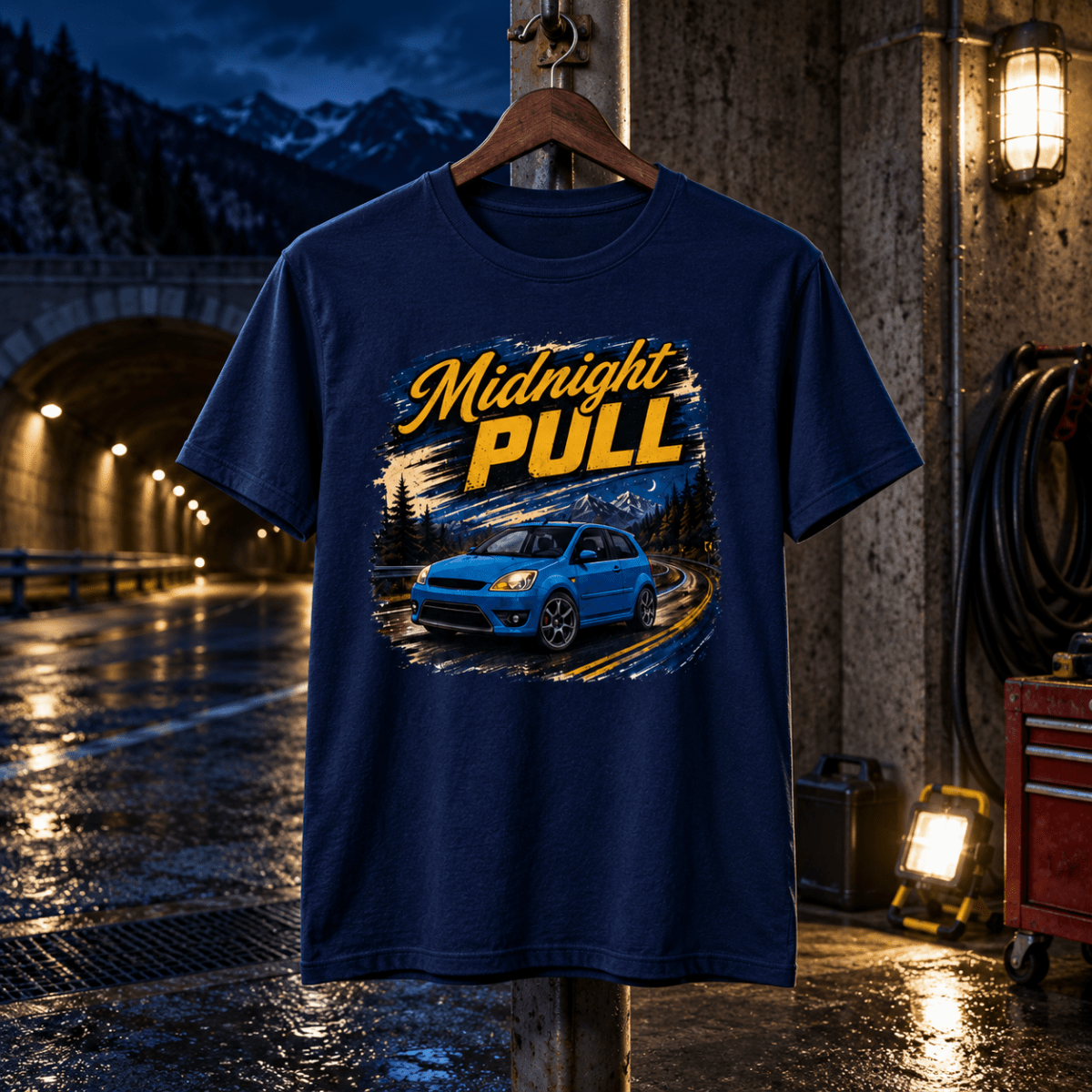 Midnight Pull navy T-shirt front in a gritty mountain tunnel garage
