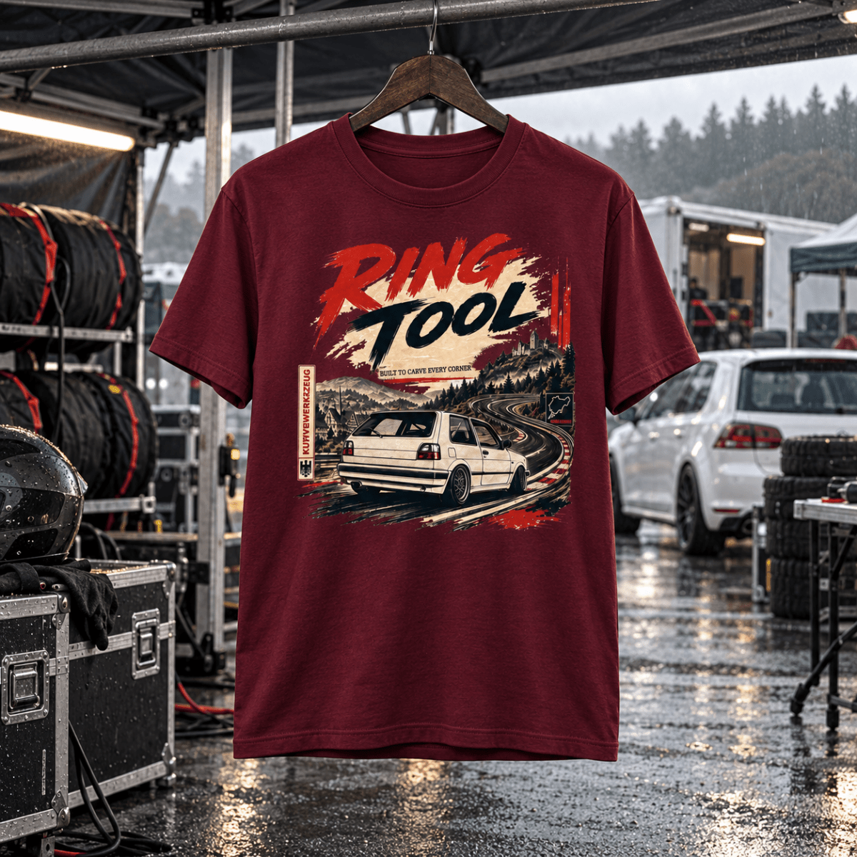 Ring Tool burgundy T-shirt front in a gritty wet track-day paddock