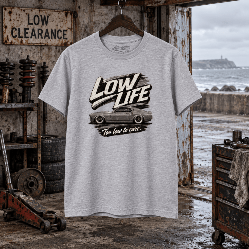 Low Life sport grey T-shirt front in a gritty seaside suspension workshop