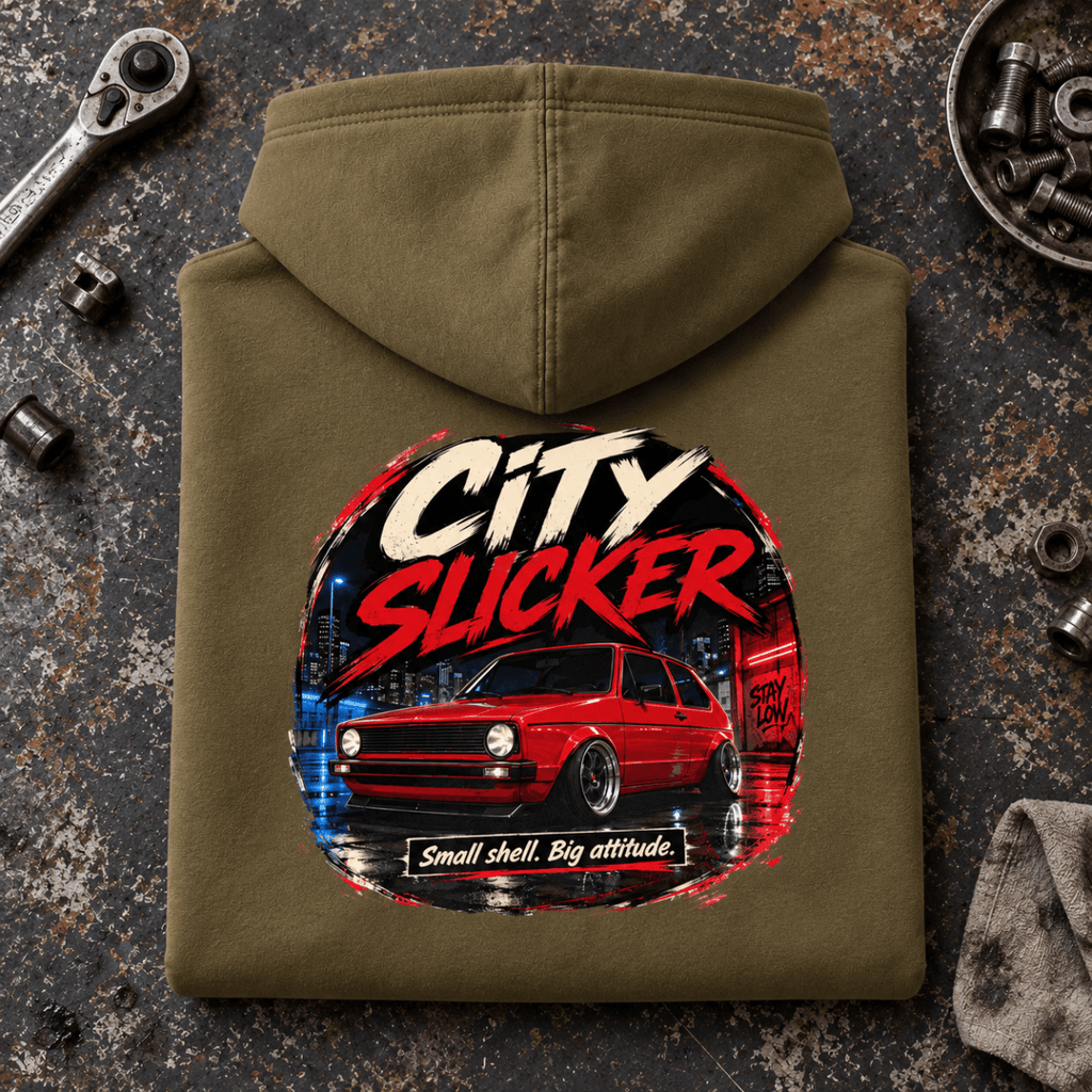 Camberline city slicker hot hatch combat green hoodie, folded rear view on a workshop bench with the complete graphic visible.