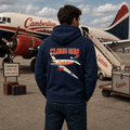 Person wearing a hoodie with 'Cloud Run' design in front of an airplane with 'Camberline' branding.