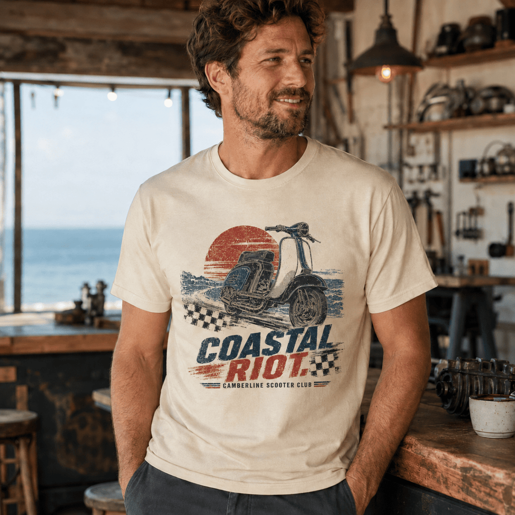 Model wearing a cream Coastal Riot vintage scooter graphic T-shirt, front view