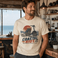 Model wearing a cream Coastal Riot vintage scooter graphic T-shirt, front view