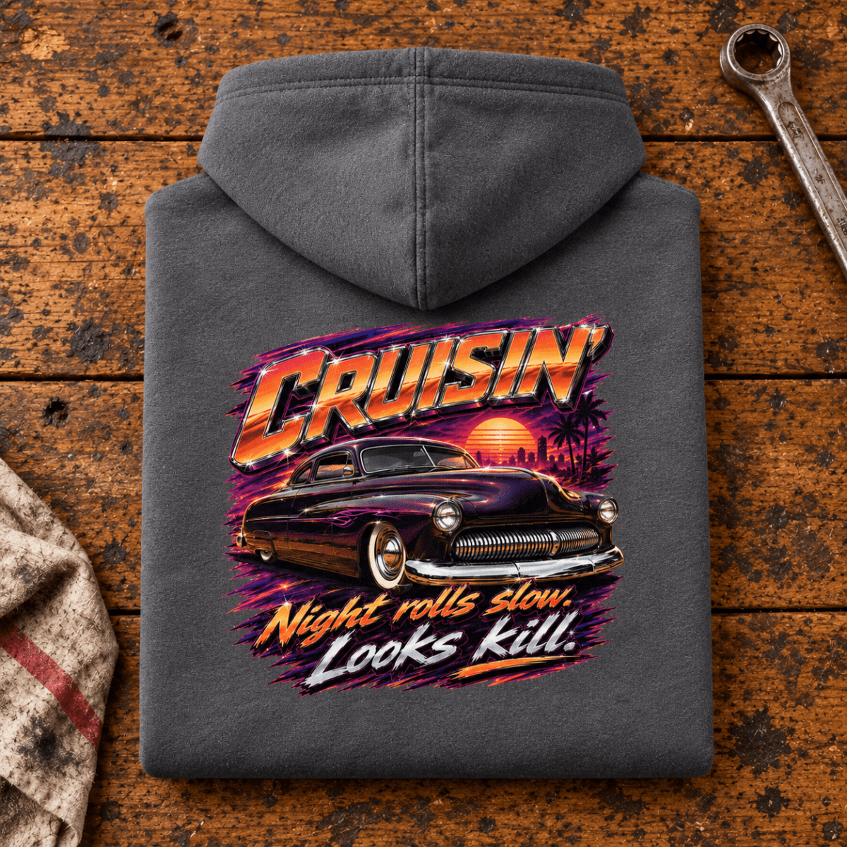 Camberline cruisin night rolls slow lowrider shark grey hoodie, folded rear view on a workshop bench with the complete graphic visible.