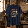 Navy Dakota DC-3 Cloud Run graphic T-shirt displayed in a rustic aviation workshop