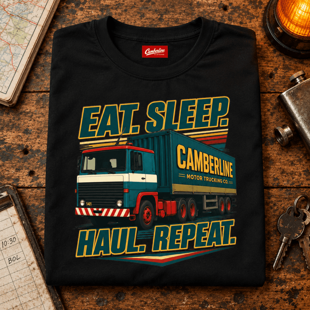 Black Eat Sleep Haul Repeat lorry T-shirt folded on a retro dispatch counter